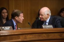 Sen. Blumenthal and Sen. Cardin confer during hearing. 
